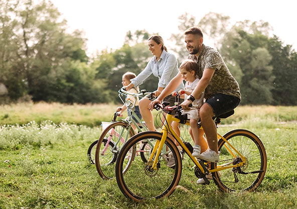 Family enjoying a bike ride outside 