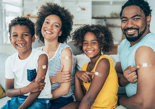 A portrait of a family who received their COVID-19 vaccine